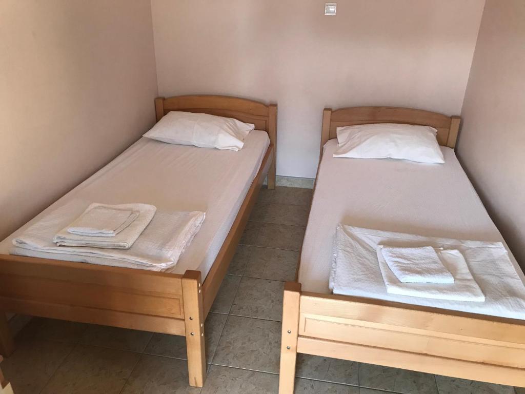 Postel nebo postele na pokoji v ubytování Apartmani Tomovic