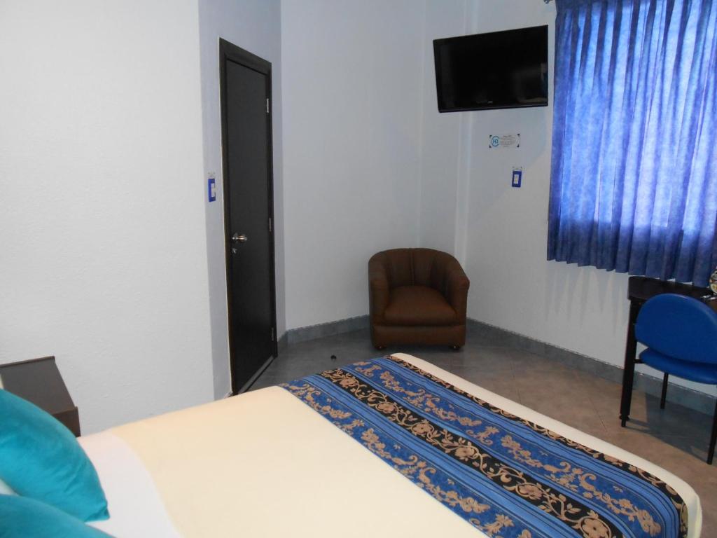 Postel nebo postele na pokoji v ubytování Hotel Del Centro