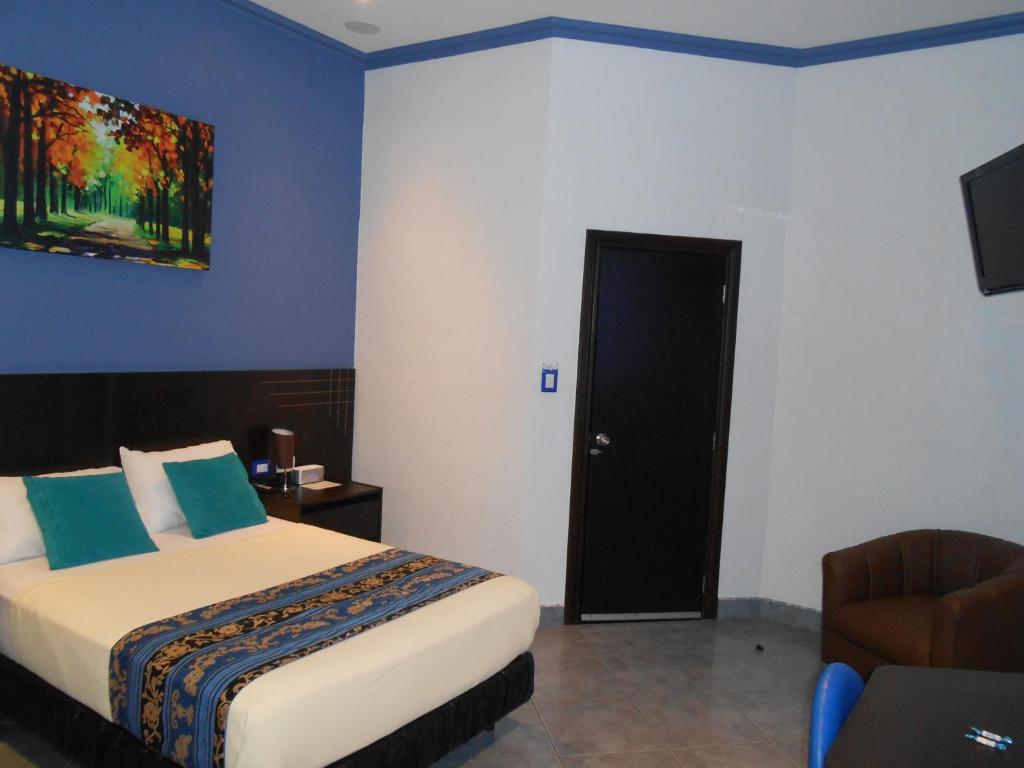 Postel nebo postele na pokoji v ubytování Hotel Del Centro
