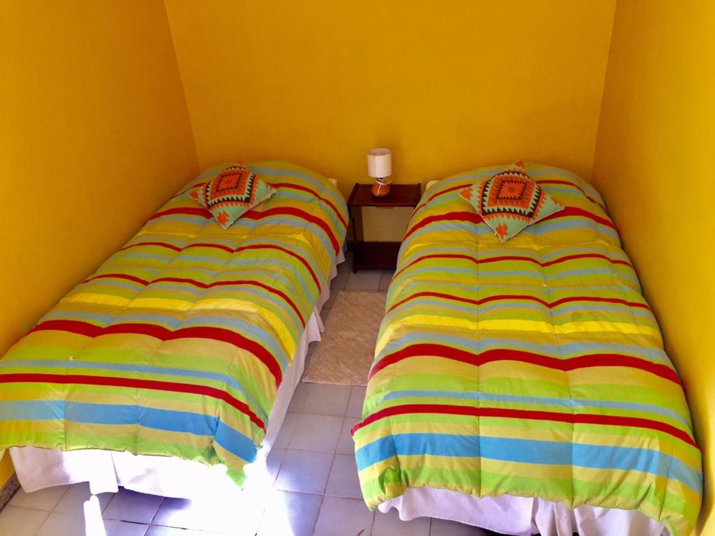 Postel nebo postele na pokoji v ubytování Hostal Intipara