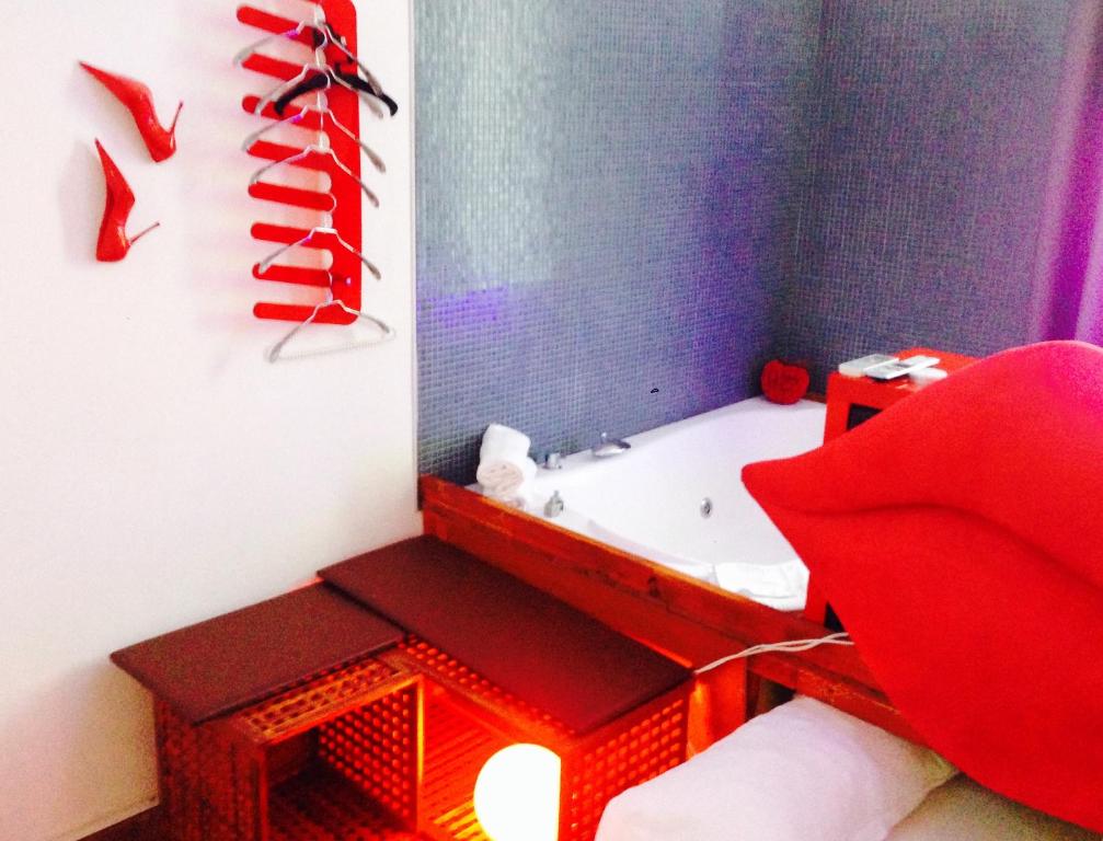 Posteľ alebo postele v izbe v ubytovaní Jacuzzi Rooms