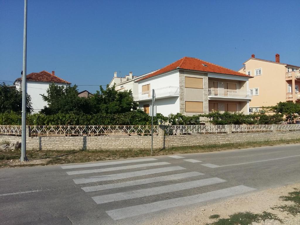 a crosswalk on a street in front of a house at Villa Feodora in Biograd na Moru