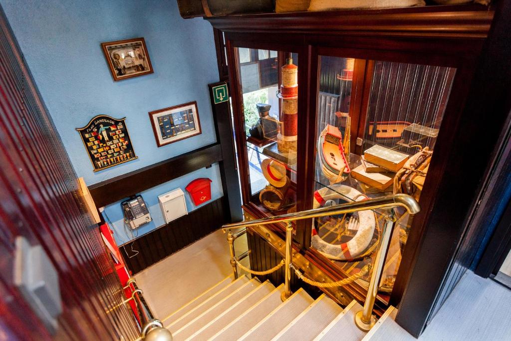 an overhead view of a staircase in a house at Boat Hotel De Barge in Bruges