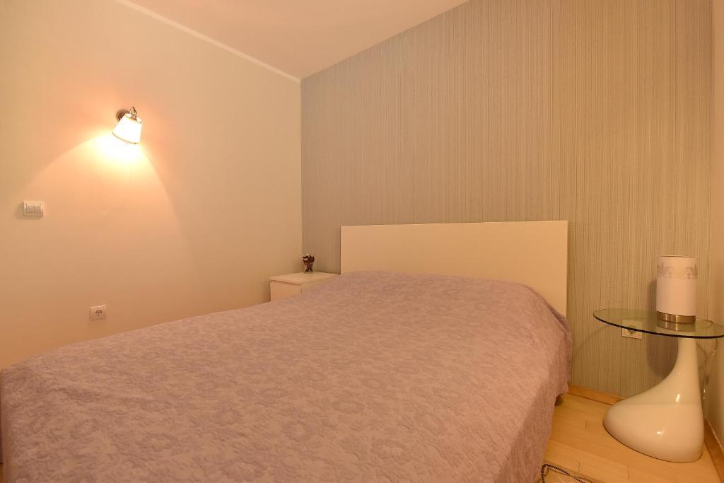 Ένα ή περισσότερα κρεβάτια σε δωμάτιο στο Apartment Maniva