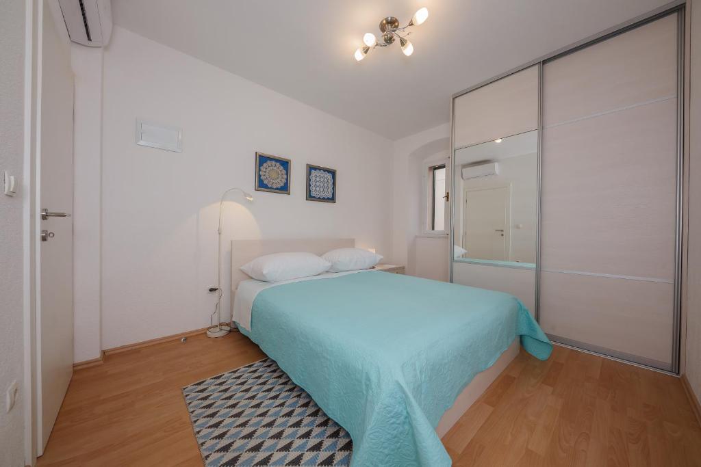 Postel nebo postele na pokoji v ubytování Apartman Mare