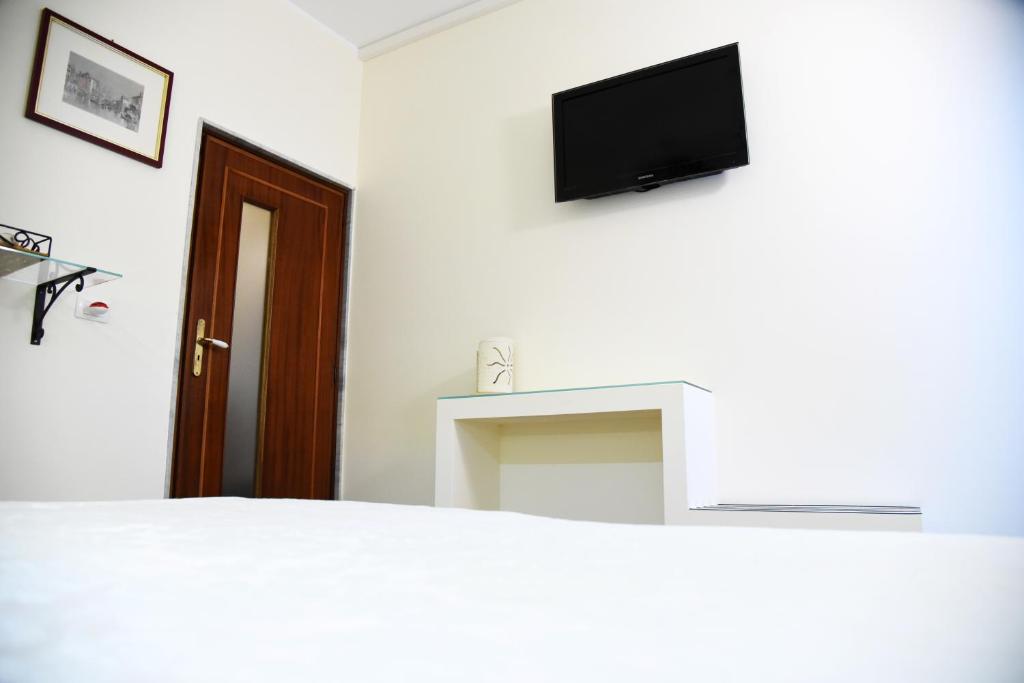 TV a/nebo společenská místnost v ubytování B&B Al Vecchio Glicine