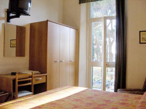 Postel nebo postele na pokoji v ubytování Hotel Firenze
