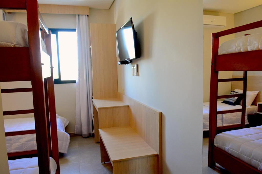 Postel nebo postele na pokoji v ubytování Mandala Hotel