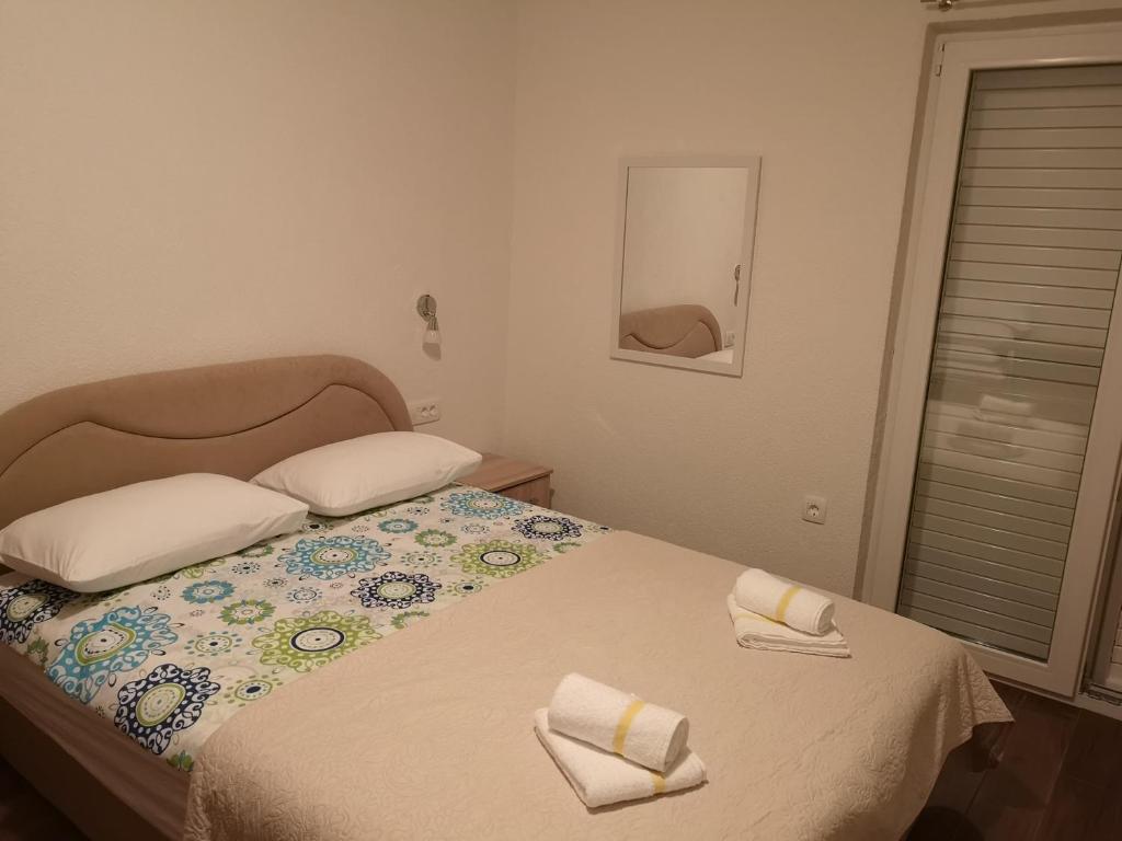 Postel nebo postele na pokoji v ubytování Apartmani Sea