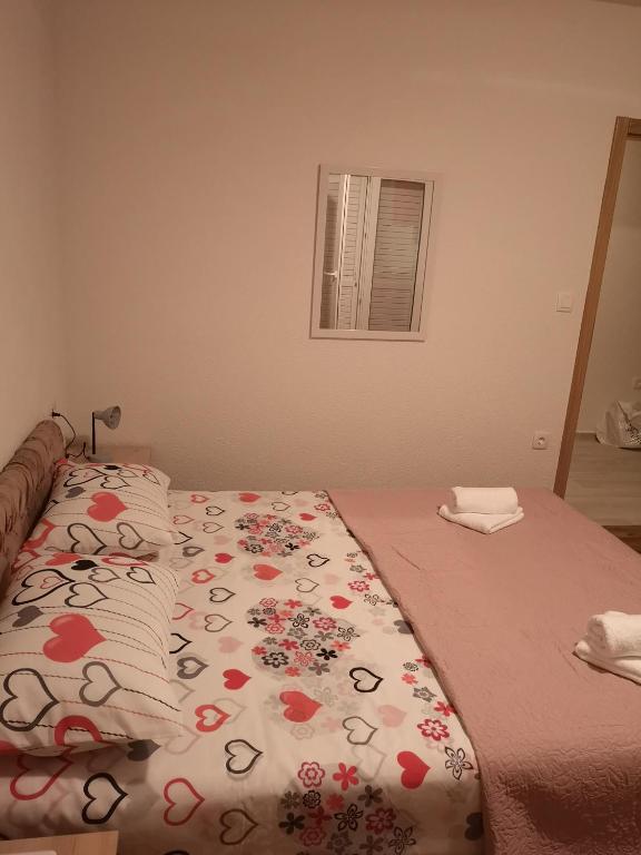 Postel nebo postele na pokoji v ubytování Apartmani Sea