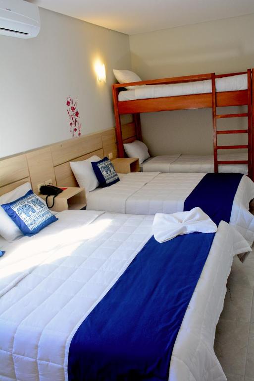 Postel nebo postele na pokoji v ubytování Mandala Hotel