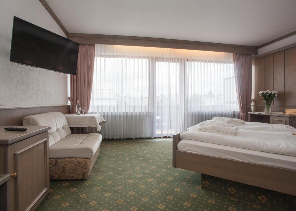 Postel nebo postele na pokoji v ubytování Hotel Hessenhof