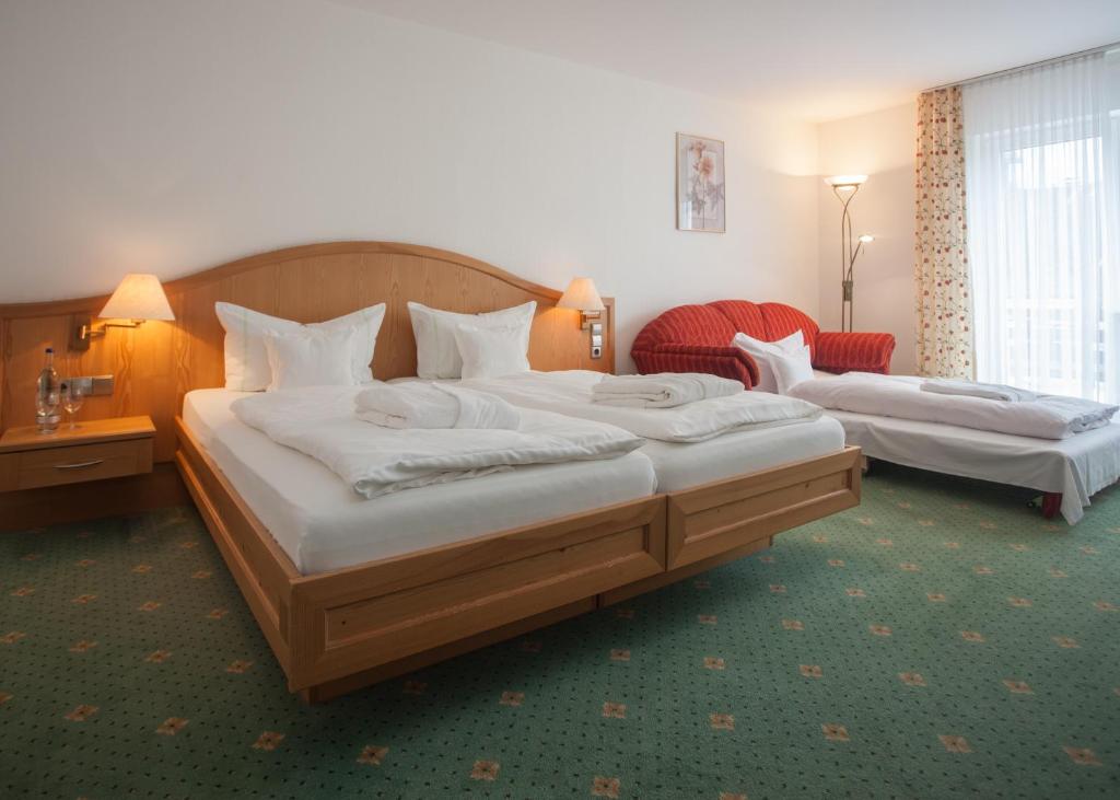 Postel nebo postele na pokoji v ubytování Hotel Hessenhof