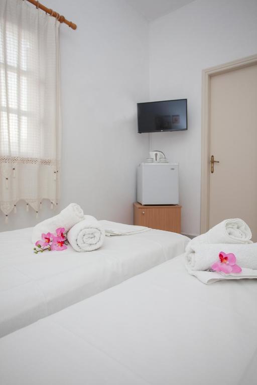 Postel nebo postele na pokoji v ubytování Anestoula Rooms