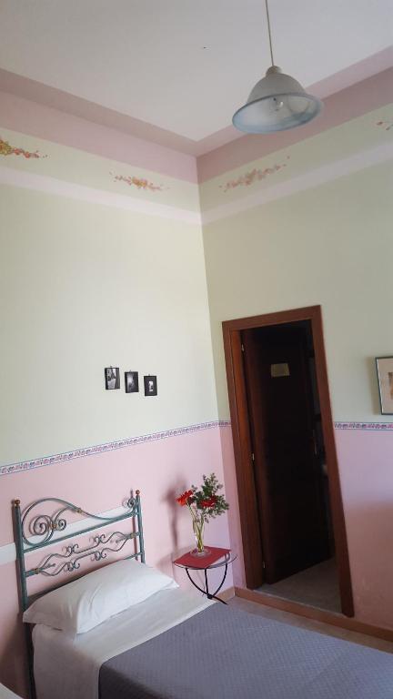 Łóżko lub łóżka w pokoju w obiekcie Locanda della Bottega