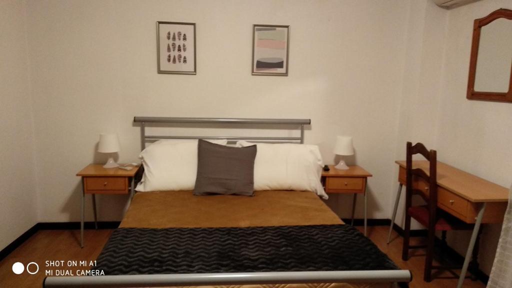 Postel nebo postele na pokoji v ubytování Residencial Do Rita em Rio Caldo