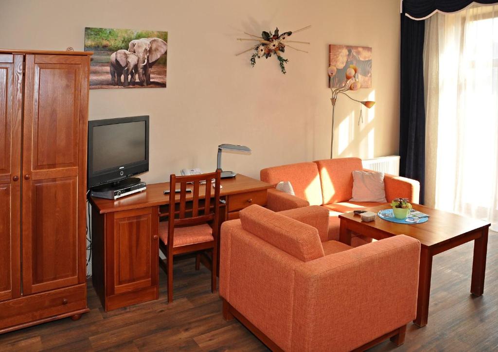 TV a/nebo společenská místnost v ubytování Hotel U Radnice