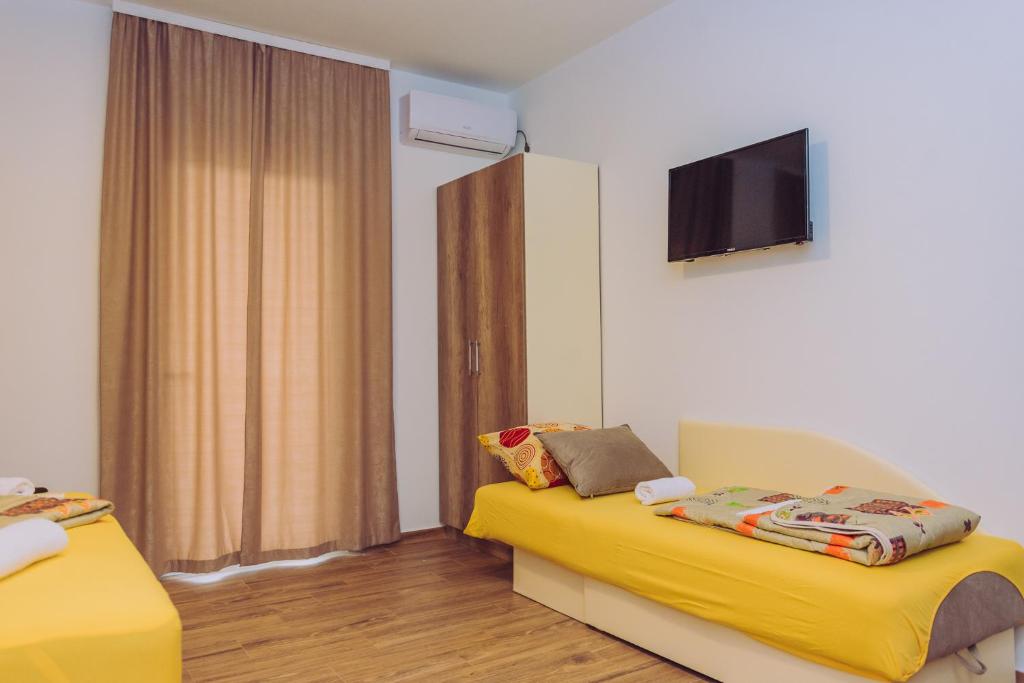 Postel nebo postele na pokoji v ubytování Apartments Krstovic