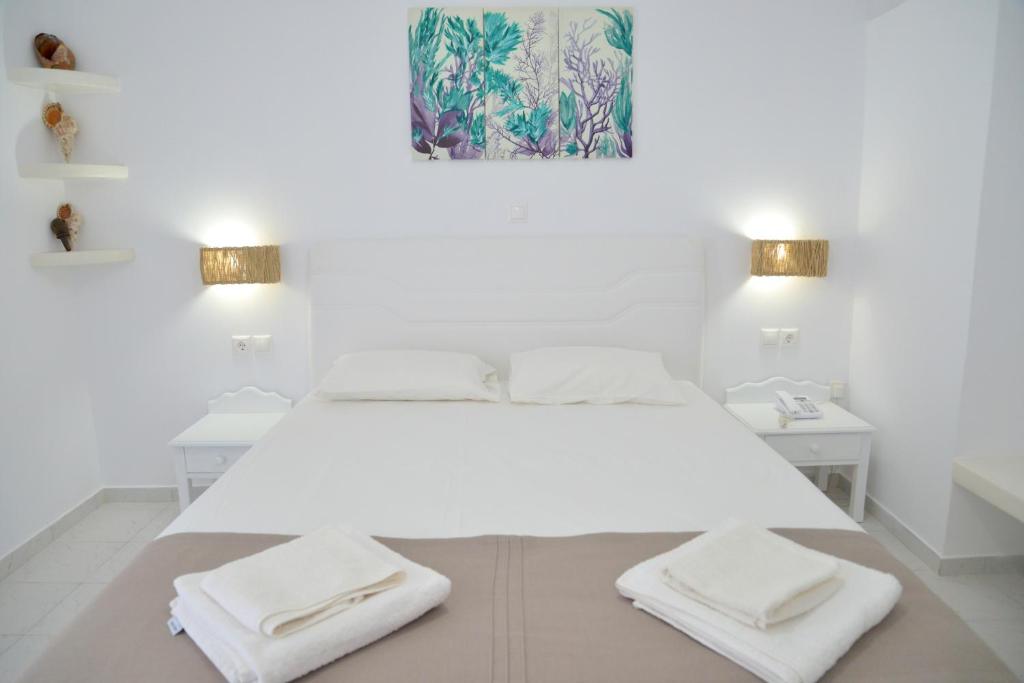 Postel nebo postele na pokoji v ubytování Corali Hotel