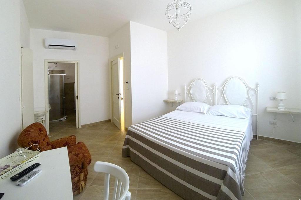 A bed or beds in a room at B&B PALAZZO MARZO