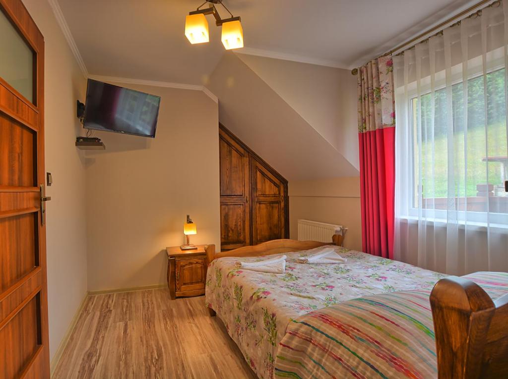 Postel nebo postele na pokoji v ubytování Pod Brzozka