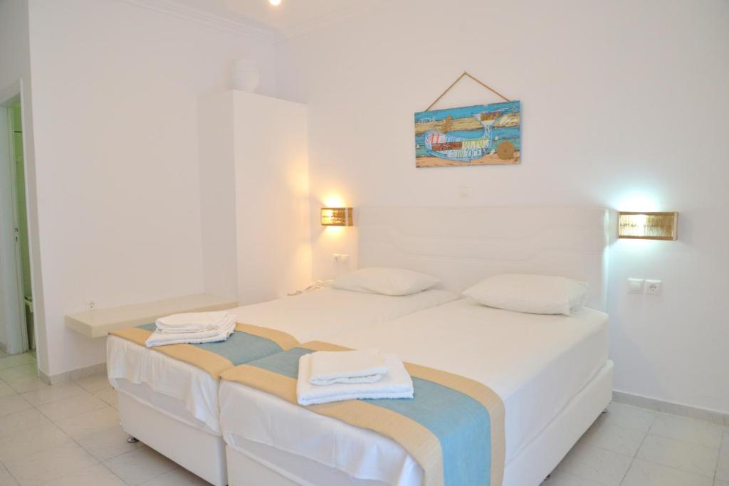 Postel nebo postele na pokoji v ubytování Corali Hotel