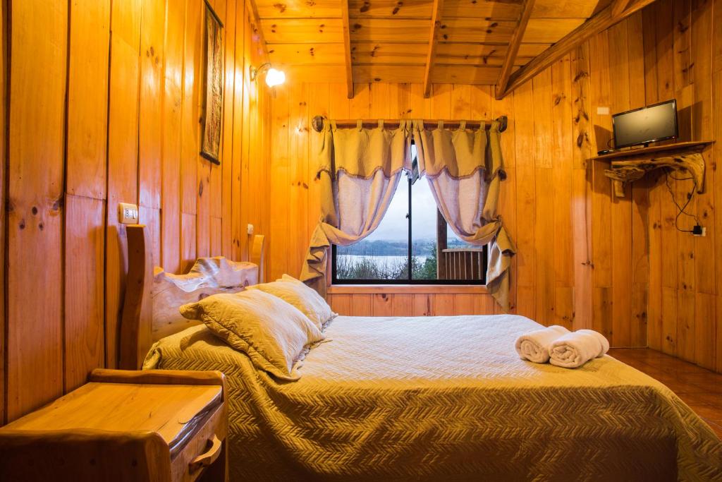 Postel nebo postele na pokoji v ubytování Apart hotel Puchaley Lafquen