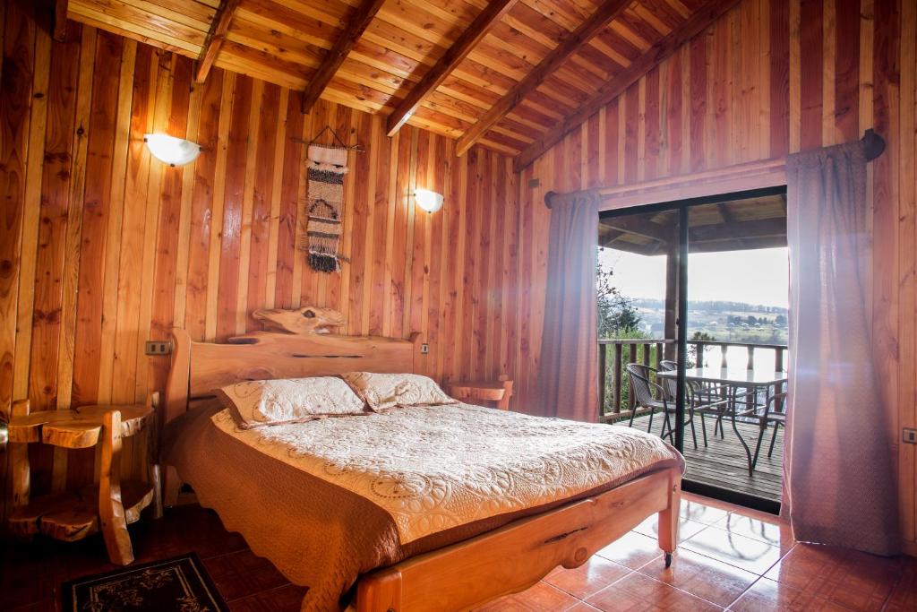 Postel nebo postele na pokoji v ubytování Apart hotel Puchaley Lafquen