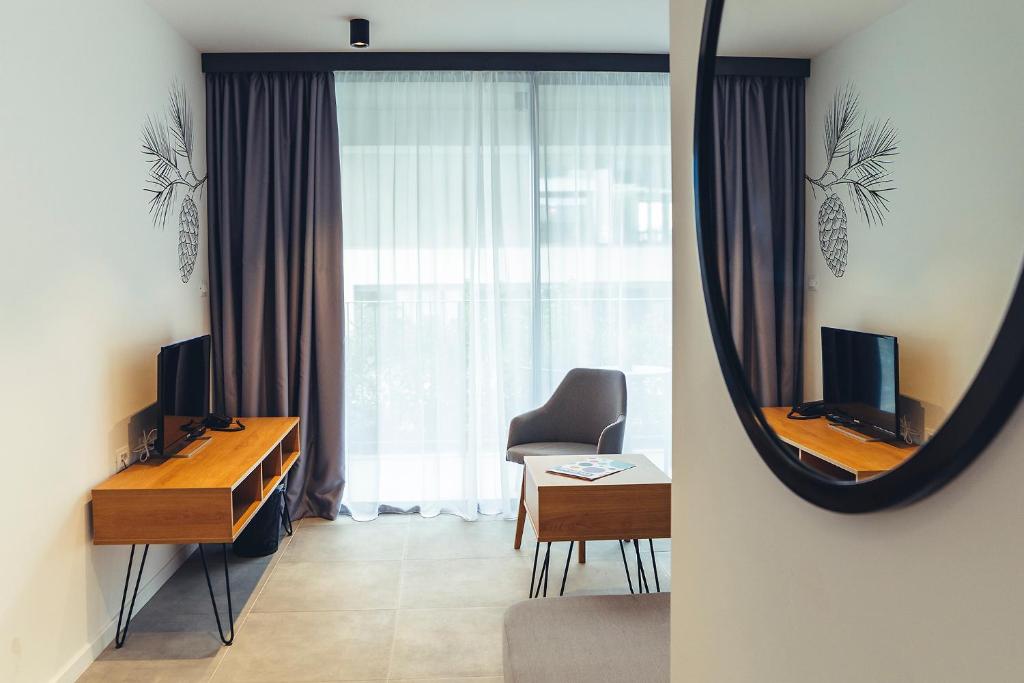 Televízia a/alebo spoločenská miestnosť v ubytovaní MORENIA All Inclusive Hotel