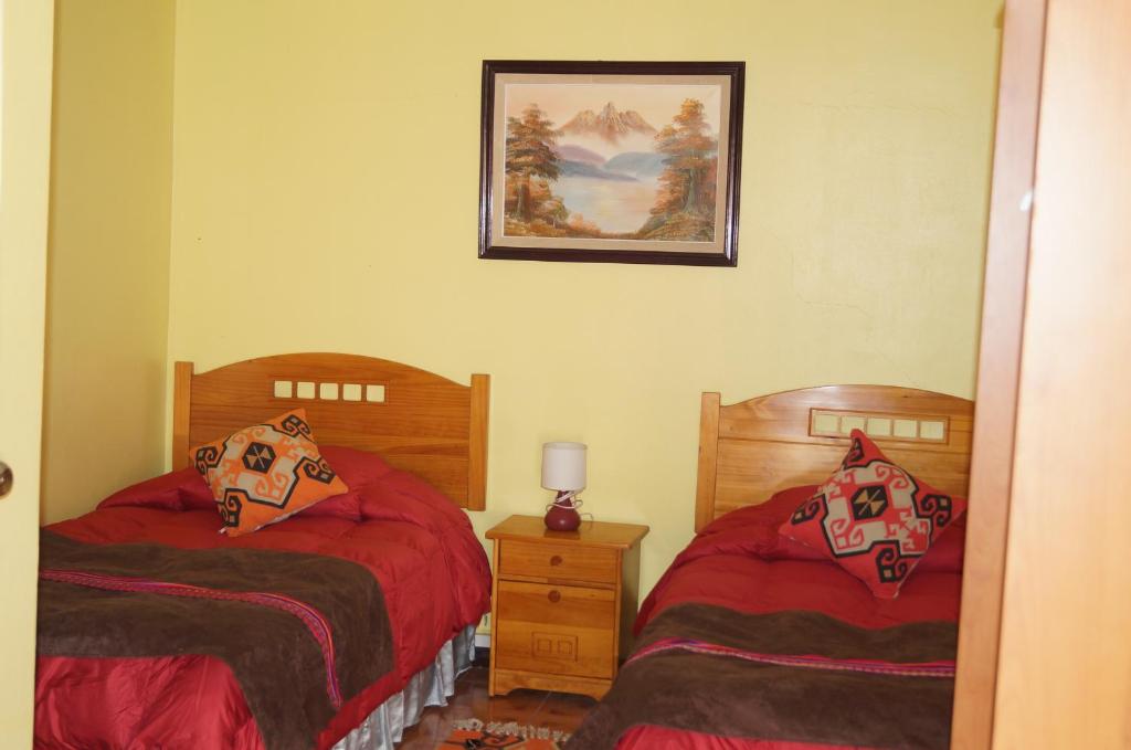 Postel nebo postele na pokoji v ubytování Hostal Intipara