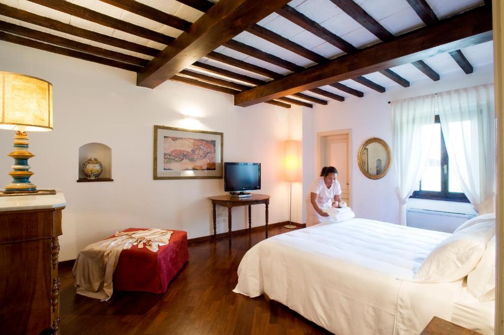Posteľ alebo postele v izbe v ubytovaní Villa I Barronci Resort & Spa