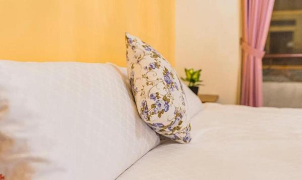 Postel nebo postele na pokoji v ubytování Yilan B&B - Happy Snail