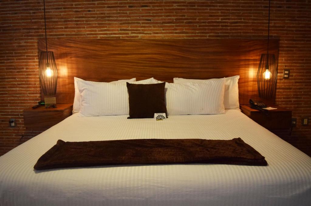 Postel nebo postele na pokoji v ubytování Hotel Casa Andaria
