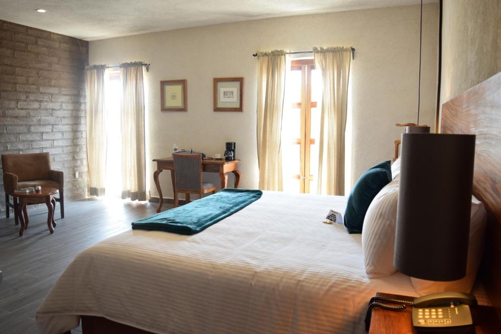 Postel nebo postele na pokoji v ubytování Hotel Casa Andaria