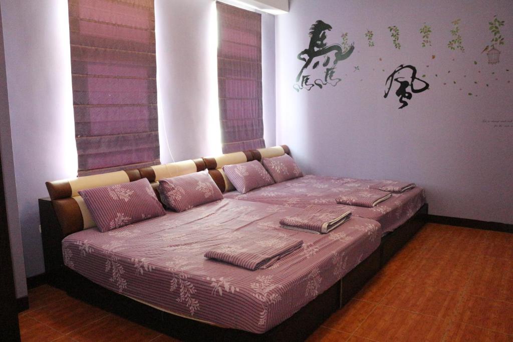 Postel nebo postele na pokoji v ubytování 驫風民宿 Equuleus Homestay
