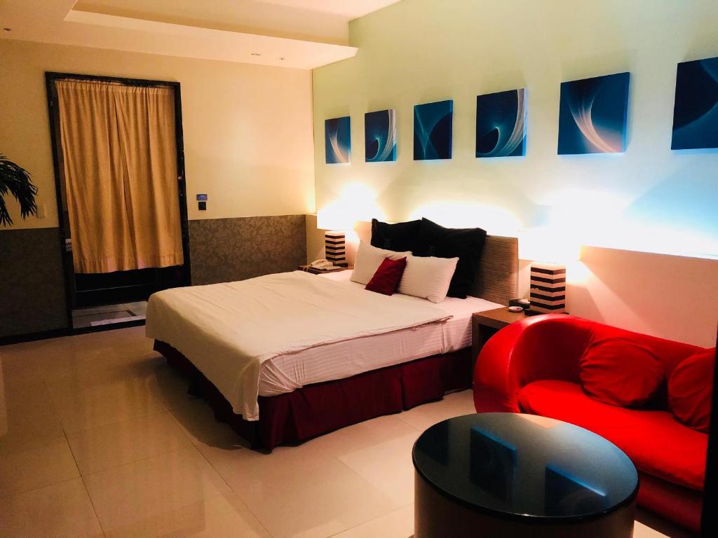 Postel nebo postele na pokoji v ubytování Discovery Motel - Zhonghe