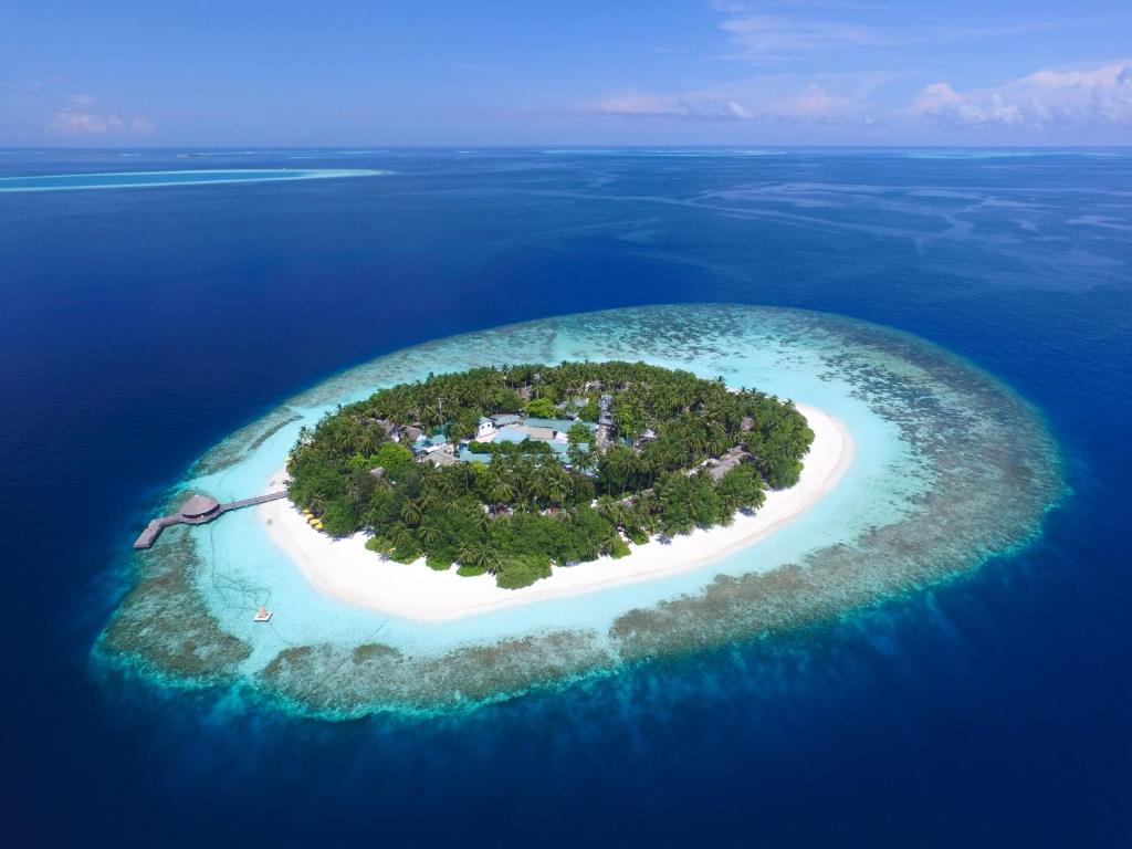 an island in the shape of a heart in the ocean at Dhawa Ihuru, part of Banyan Group - All inclusive with Free Transfers in Male City