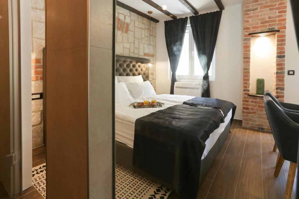 Posteľ alebo postele v izbe v ubytovaní Luxury Rooms Dino