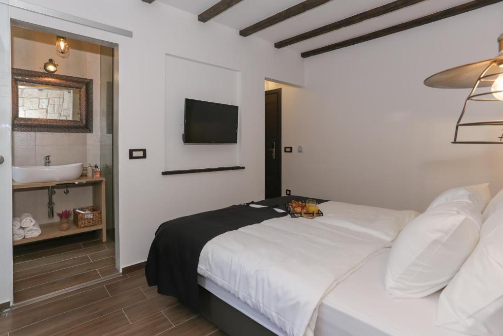 Posteľ alebo postele v izbe v ubytovaní Luxury Rooms Dino