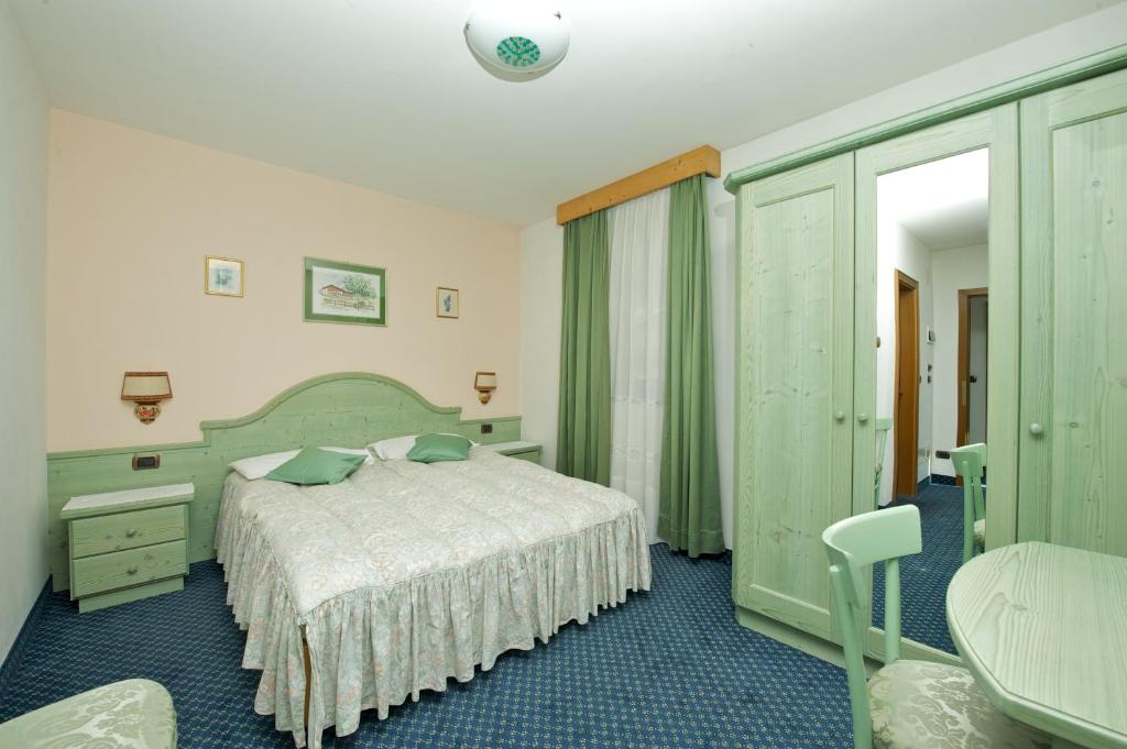 Postel nebo postele na pokoji v ubytování Hotel Al Lago