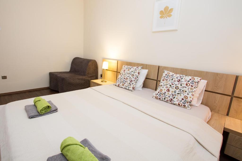 Postel nebo postele na pokoji v ubytování Green Residence Élményközpont Velence