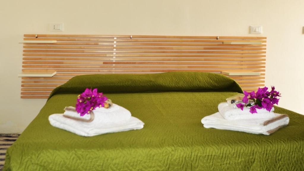 Postel nebo postele na pokoji v ubytování Horizon Pantelleria