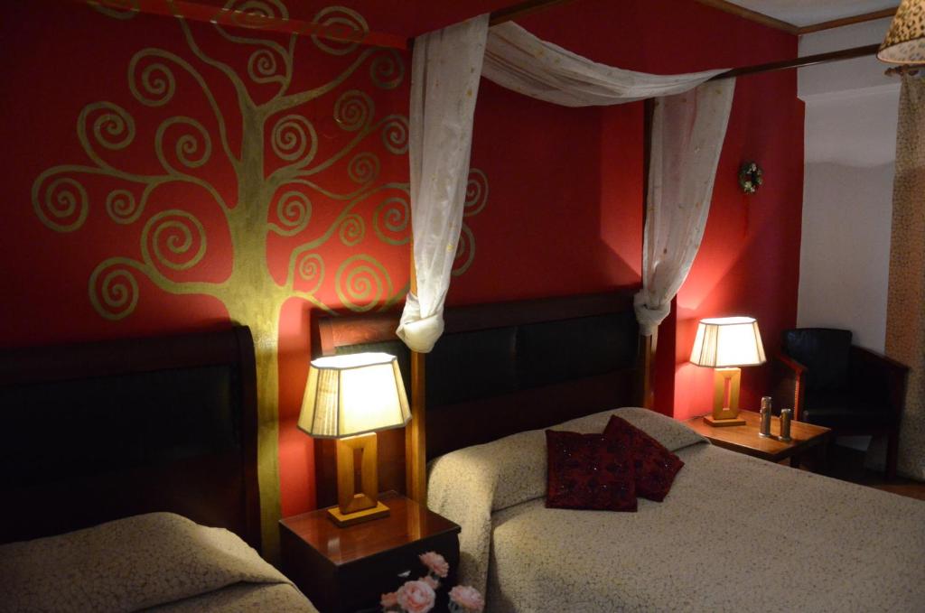 Łóżko lub łóżka w pokoju w obiekcie Hotel Electra