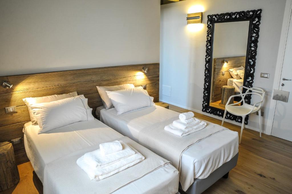 Łóżko lub łóżka w pokoju w obiekcie Corte Grisela Wine&Relax