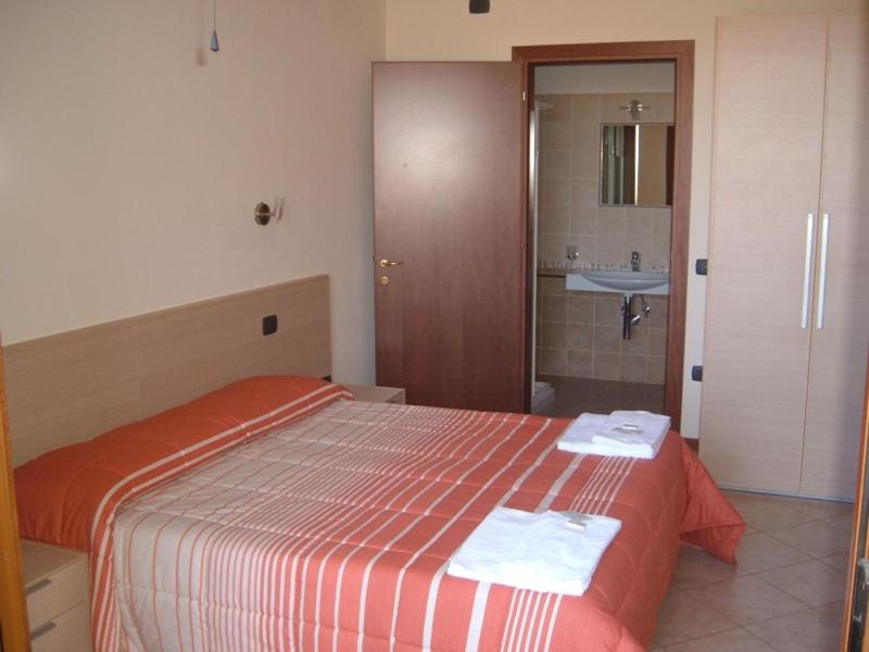 Postel nebo postele na pokoji v ubytování Hotel Magnolia