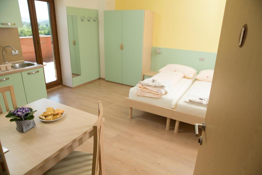 Postel nebo postele na pokoji v ubytování Zoi Apartments