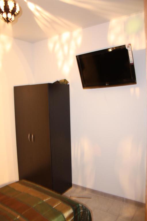 TV a/nebo společenská místnost v ubytování L'Acilya
