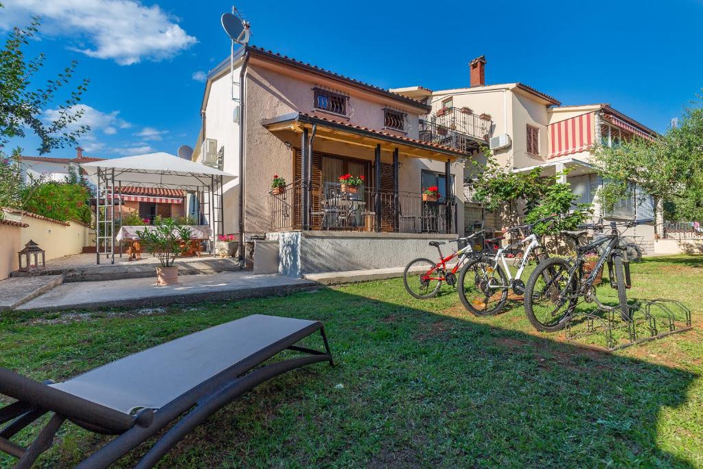 a group of bikes parked in front of a house at House Nono in Poreč