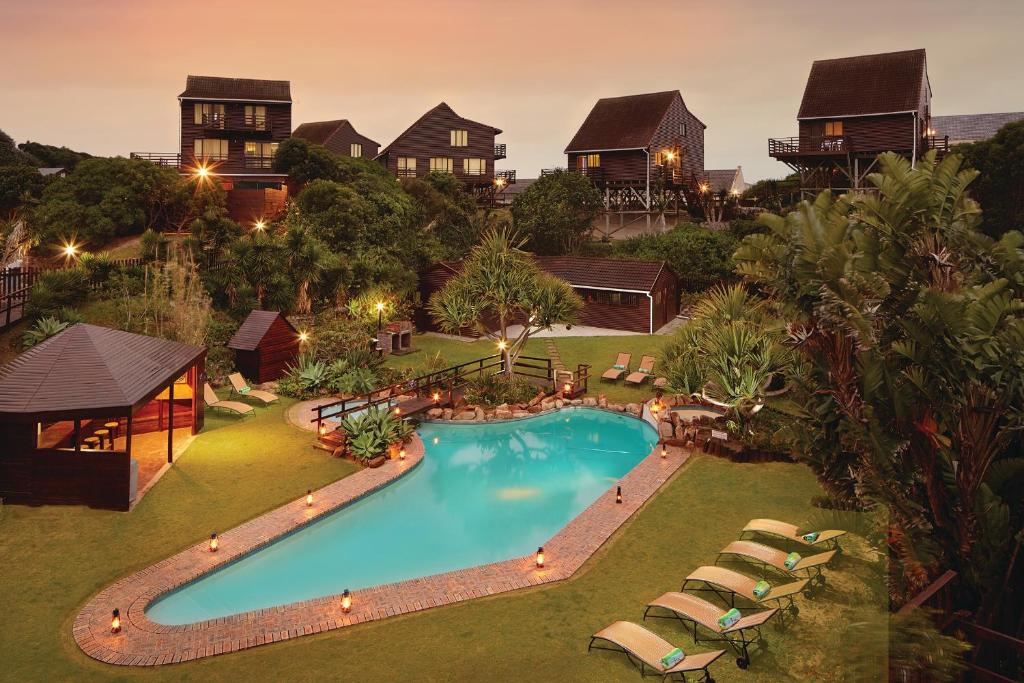 an overhead view of a swimming pool in a resort at First Group Kowie River Chalets in Port Alfred