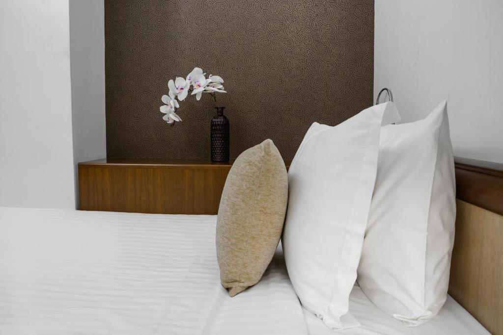 Postel nebo postele na pokoji v ubytování City5 ROOMS & SUITES by LSA